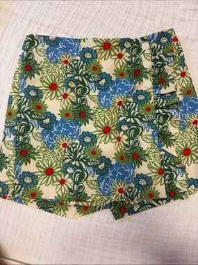 Tory Burch golf skort. Cream with Green, Blue & Red Floral.